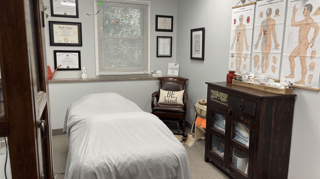 Interior view of Dr. Angela Moryc-Flyntz's acupuncture office in Huntington, NY, featuring a tranquil and welcoming atmosphere with acupuncture treatment tables, calming decor, and natural light.