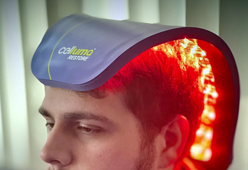 person using Celluma red light therapy